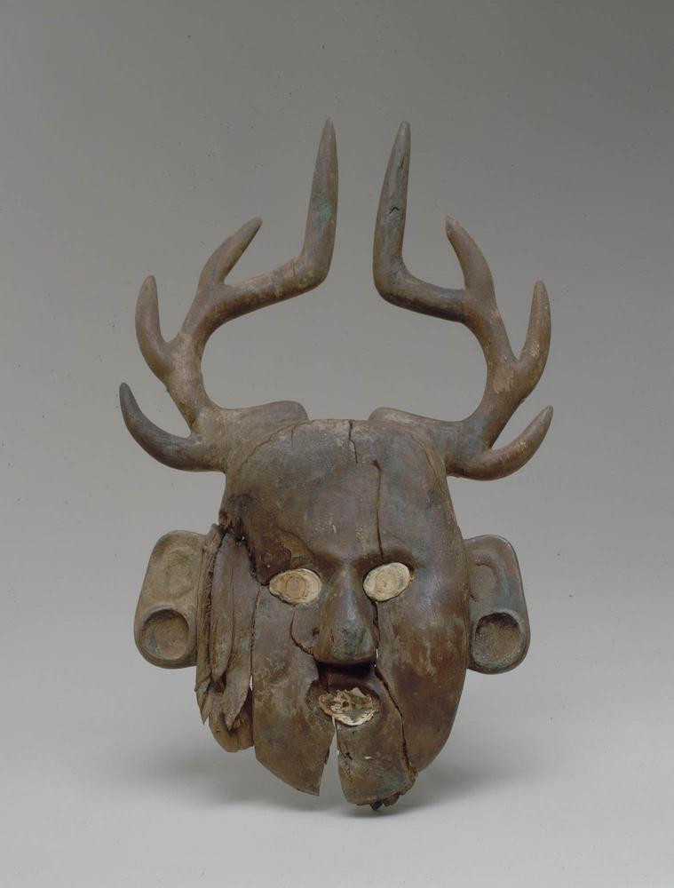 Human face effigy with deer antlers